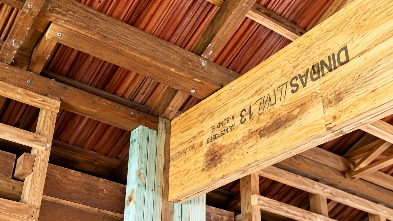 Engineered LVL beam supporting roof framing following a wall removal